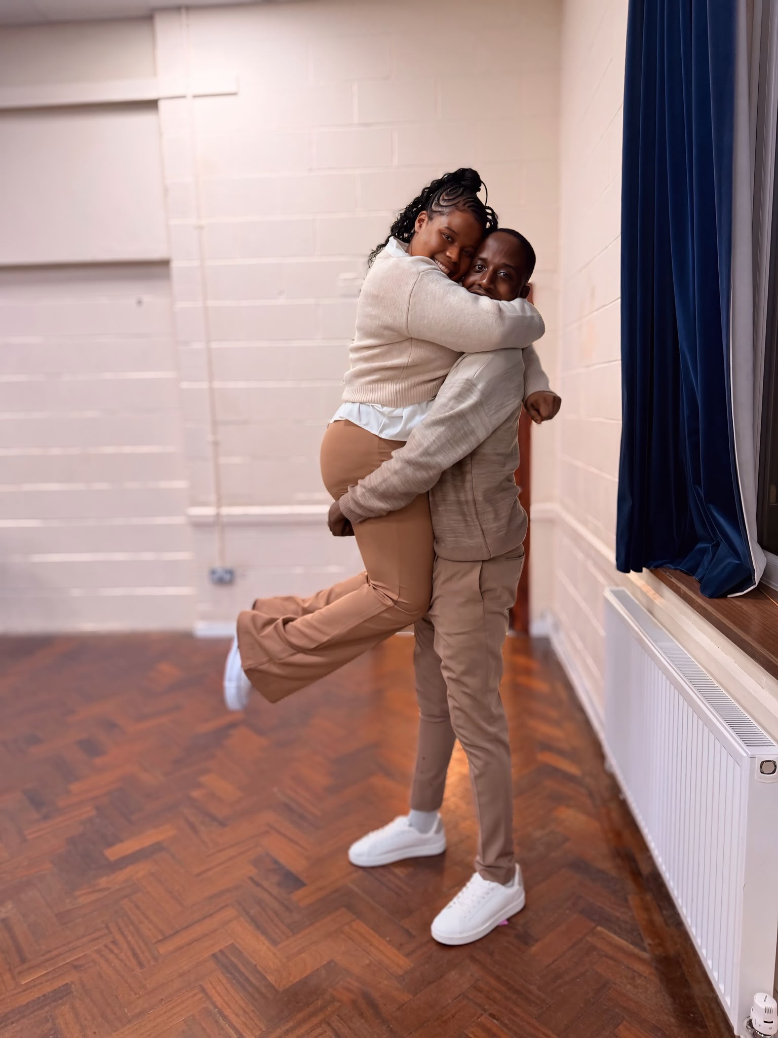 Munashe and Rudo sharing a playful embrace