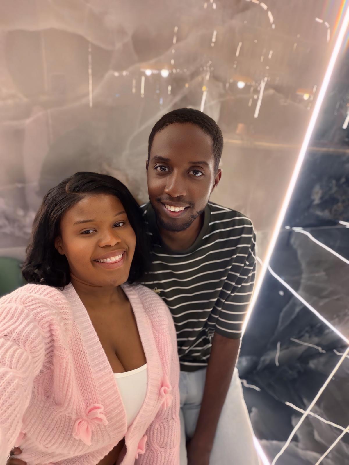 A selfie of Munashe and Rudo, with Rudo wearing a pink cardigan